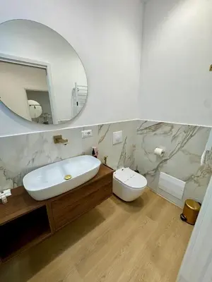 a bathroom with a sink and a toilet and a mirror at Scala 37 interno 1, Trastevere, Rome in Rome
