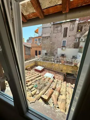 a window view of a building under construction at Scala 37 interno 1, Trastevere, Rome in Rome