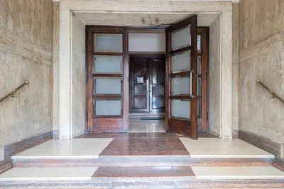 an empty hallway with two doors in a building at 59 Riverside in Rome