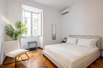 a living room with a table and chairs and a couch at Incanto al Colosseo - Terrace retreat in Rome