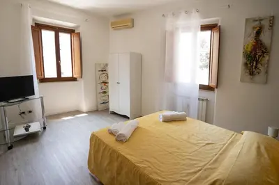 a kitchen with a sink and a stove top oven at Torpigna Rainbow in Rome