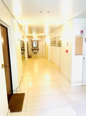 an empty hallway in a building with a hallway at Amazing Roma Vaticano in Rome