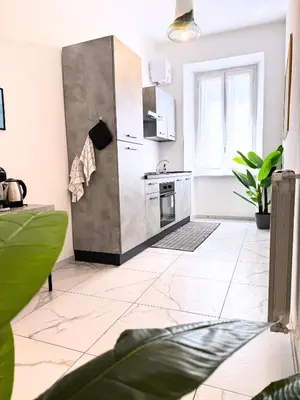 a kitchen with a sink and a stove at Trastevere Home in Rome