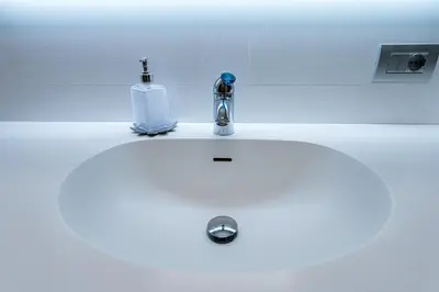 a bathroom sink with a soap dispenser on it at Domus Villae Rome Spanish Steps in Rome