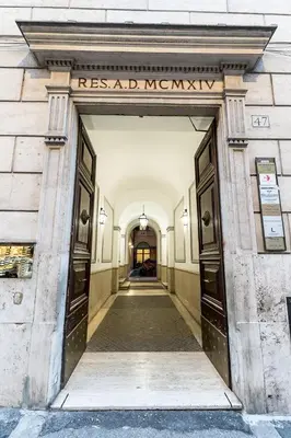 an entrance to a building with a sign that readsresistived manuscript at Domus Villae Rome Spanish Steps in Rome