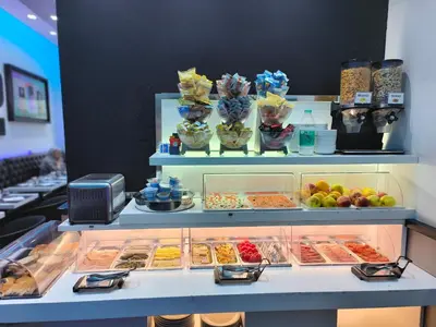 a display case filled with different types of food at Settecento Guest House in Rome