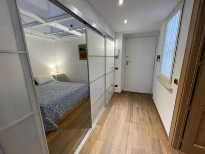 a bedroom with a bed and a glass wall at Foro Romano Apartments D in Rome