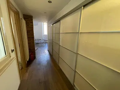 a hallway with glass panels on a wall at Foro Romano Apartments D in Rome