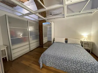 a bedroom with a bed in a room at Foro Romano Apartments D in Rome