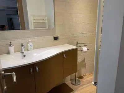 a bathroom with a sink and a mirror at Foro Romano Apartments D in Rome