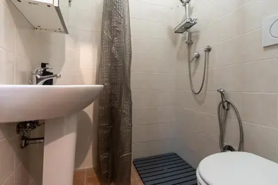a bathroom with a sink and a toilet and a shower at Imperial Garden Suite - 300 m to Metro B, A-C, Rome in Rome