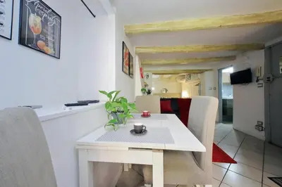 a white table and chairs in a room at Al moro in Rome
