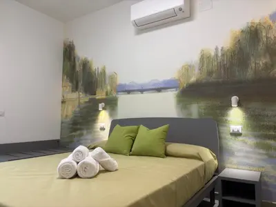 a bedroom with a bed with towels on it at My Secret Room in Rome