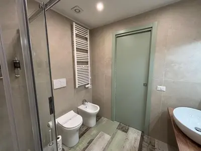 a bathroom with a toilet and a sink at My Secret Room in Rome