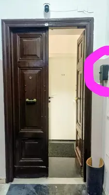a brown door with a pink number on it at little roma apartment in Rome
