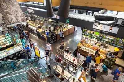an overhead view of a supermarket with people walking in the aisle at little roma apartment in Rome