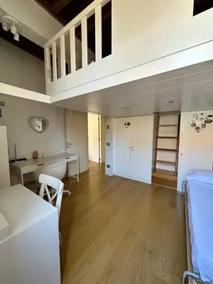 a large living room with a loft at Roman Dream Stay in Rome