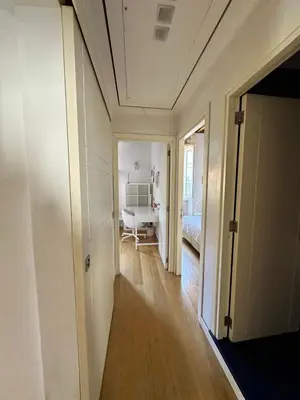 a room with a hallway with a bed and a room with a hallway at Roman Dream Stay in Rome