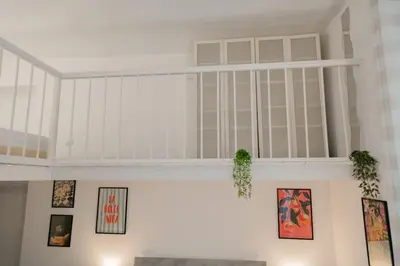 a white room with pictures on the wall at Domus Aura in Rome