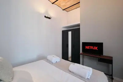 a bedroom with a bed with two towels on it at Circo Massimo Suite - In the heart of Testaccio in Rome