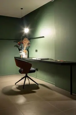 a desk with a chair and a lamp in a room at Gracchi39 Apartment in Rome