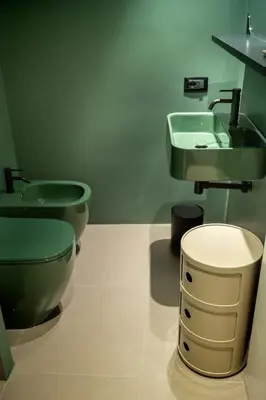 a bathroom with two toilets and a sink at Gracchi39 Apartment in Rome