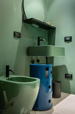 a bathroom with a bowl sink and a mirror at Gracchi39 Apartment in Rome