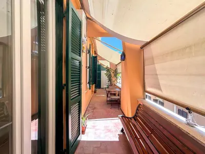 an empty corridor of a building with a bench at Modern apartment with Private Balcony Near Colosseum in Rome
