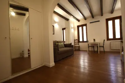 a living room with a couch and a table at Serpenti Holiday House in Rome