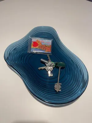 a blue tray with a pair of keys on it at Celestina Holiday Home Policlinico Gemelli in Rome