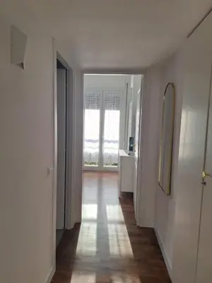 an empty room with a hallway with a large window at Celestina Holiday Home Policlinico Gemelli in Rome