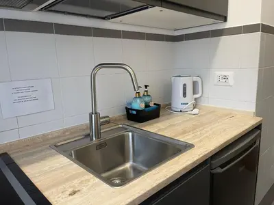 a kitchen with a sink and a counter top at Celestina Holiday Home Policlinico Gemelli in Rome