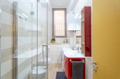 a bathroom with a sink and a toilet and a shower at Sallustiano - Porta Pia - Rooms in Rome