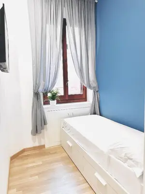 a bedroom with a bed and a window at San Giovanni Lulus Home in Rome