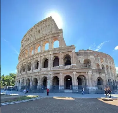 a large building with people standing in front of it at Tasso 39 in Rome
