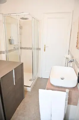 a bathroom with a sink and a shower at Tasso 39 in Rome