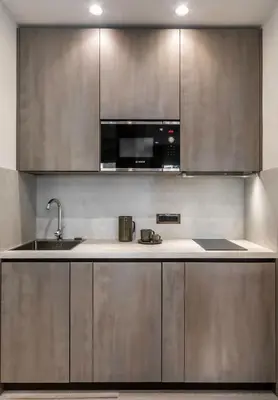 a kitchen with stainless steel cabinets and a sink at Junior Deluxe in Rome