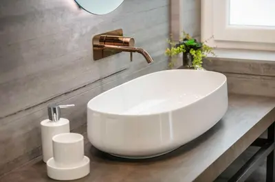 a bathroom with a white sink and a faucet at Junior Deluxe in Rome