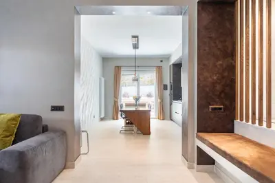 a living room with a couch and a table at Pool & Spa Deluxe in Rome
