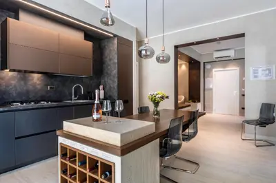 a kitchen with a bar and a dining room at Pool & Spa Deluxe in Rome