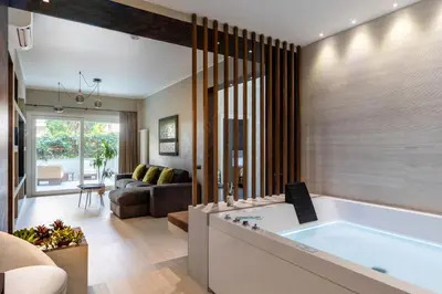 a living room with a large tub in the middle at Pool & Spa Deluxe in Rome