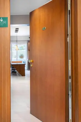 a wooden door with a sign on it in a room at Pool & Spa Deluxe in Rome