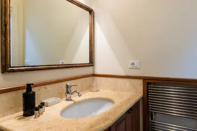 a bathroom with a sink and a mirror at Monti Atmosphere Apartment by Rental in Rome in Rome