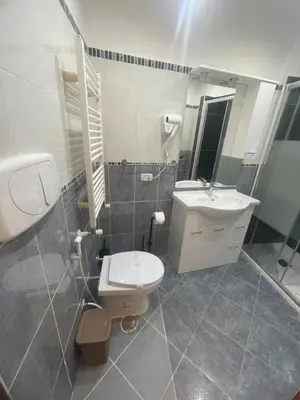 a bathroom with a white toilet and a sink at Rome jubilee stays 2 in Rome