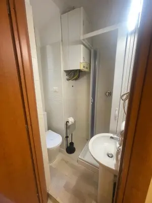 a small bathroom with a toilet and a sink at Rome jubilee stays 2 in Rome