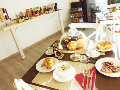 a table with plates of food on top of it at B&B More Than Rome in Rome