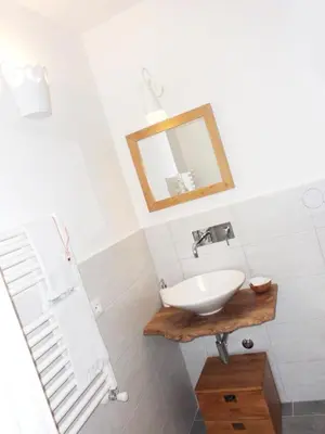 a bathroom with a sink and a mirror at B&B More Than Rome in Rome