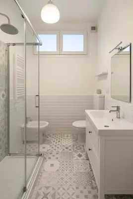 a bathroom with a shower and a toilet and a sink at Sole 34 Apartment in Rome