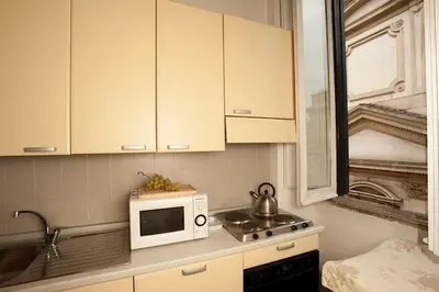 a kitchen with a microwave and a sink at Finestre sul Tevere in Rome
