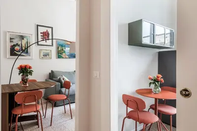 a living room with a table and chairs at Maggiore Home in Rome